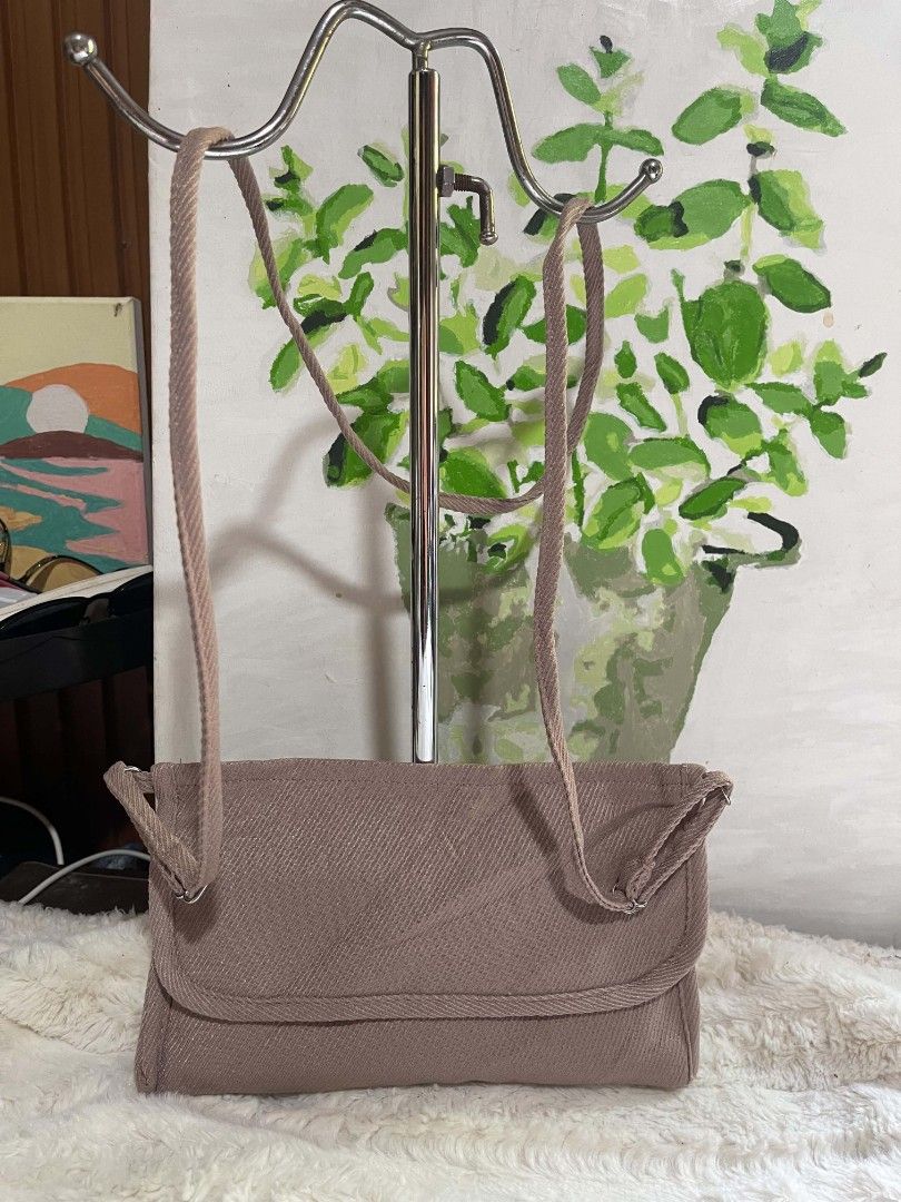 Light Pink Textured Crossbody Bag with Adjustable Strap (Category: Cross-body Bags) located in Naawan. Submitted by twilly.apparel2 (Listing ID 1462956805, Image 1). Description: - Cute textured crossbody bag - Light pink/mauve shade - Long adjustable strap - Interior pockets for organization - Fits phone easily - Ideal for daily necessities - Simple and practical design.