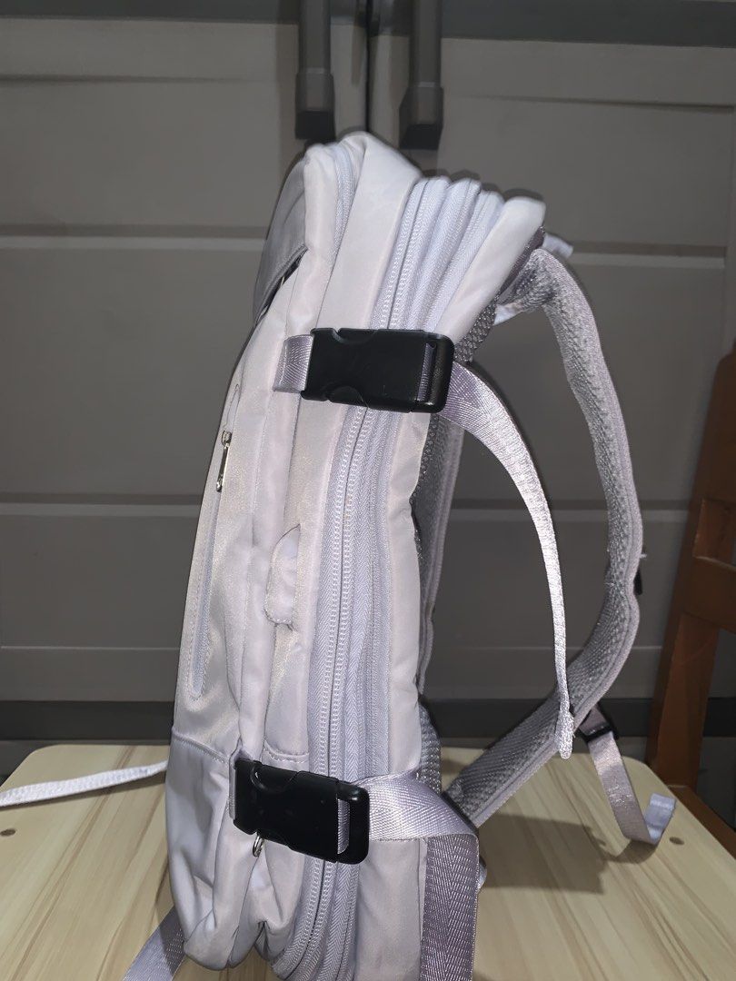 Light Purple Travel Backpack with Multiple Zippers (Category: Backpacks) located in Manila. Submitted by jo.arban (Listing ID 1462897947, Image 2). Description: - Light purple backpack - Main compartment with front zippered pocket - Side buckles for compression - Padded shoulder straps for comfort - Top handle for easy carrying - Ideal for travel or daily use - Zippers are in smooth working condition.
