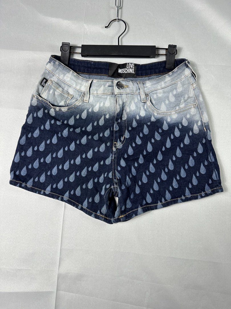 Llve Moschino Y2K Rain Drops Short (Category: Shorts) located in Cabanglasan. Submitted by thefashiongarage.co (Listing ID 1463034305, Image 1). Description: Title - Love Moschino Model/Name - Rain Drops Short Size on Tag - Medium Conditiion - Excellent Condition with no issue Dimension (WxLxH) - 28-30x12.5 inches Category- Casual/Y2K Fitting - True to size - Stretchable Made in - Tunisia Material - Color - Blue Design - Rain Drops Year - Inclusi