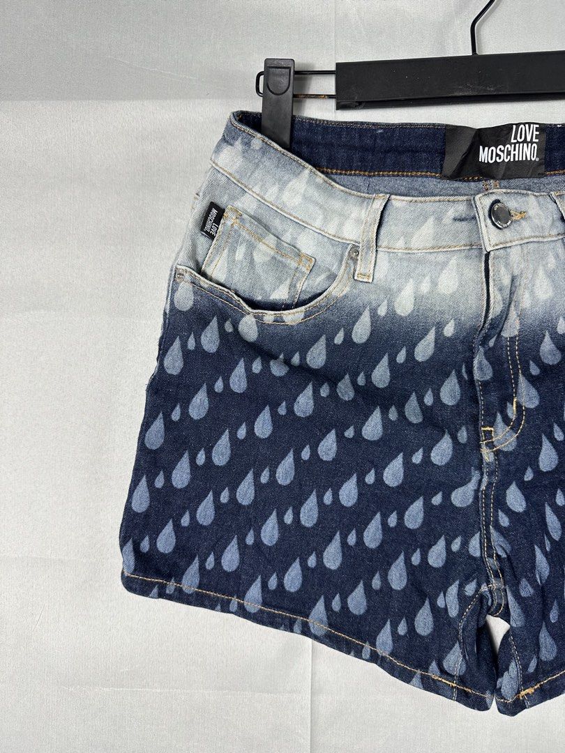 Llve Moschino Y2K Rain Drops Short (Category: Shorts) located in Cabanglasan. Submitted by thefashiongarage.co (Listing ID 1463034305, Image 3). Description: Title - Love Moschino Model/Name - Rain Drops Short Size on Tag - Medium Conditiion - Excellent Condition with no issue Dimension (WxLxH) - 28-30x12.5 inches Category- Casual/Y2K Fitting - True to size - Stretchable Made in - Tunisia Material - Color - Blue Design - Rain Drops Year - Inclusi