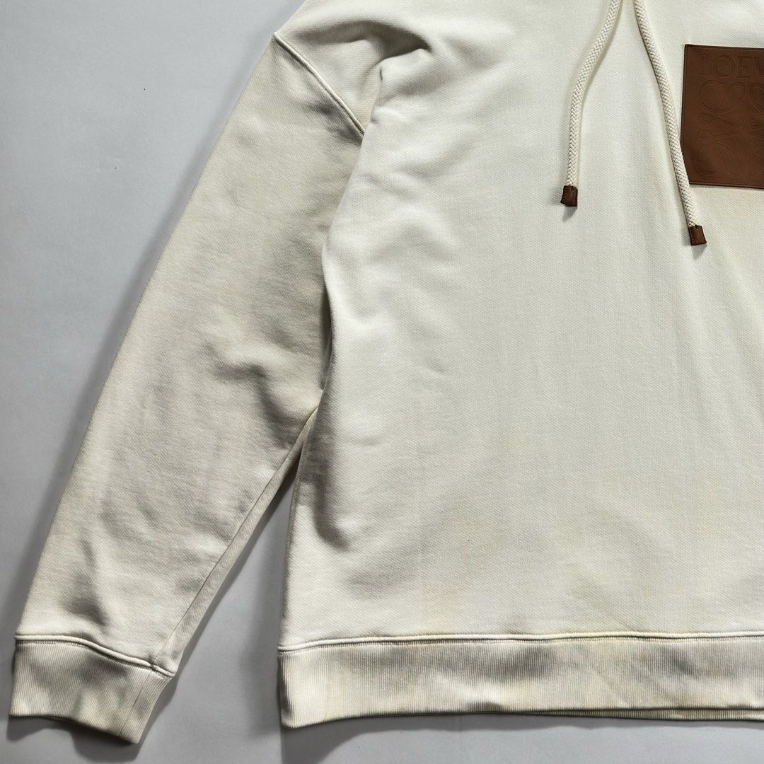 Loewe - Anagram Leather Patch Hoodie (Category: Luxury Apparel) located in Manila. Submitted by whitemarket. (Listing ID 1461633700, Image 2). Description: Size Small but fits Large Width - 24” Length - 29.5” Gently used Flaws: Color bleeding from the leather patch on different parts but not really noticeable as it blends with the original color of the jacket. Kindly refer to the detailed photos. .
