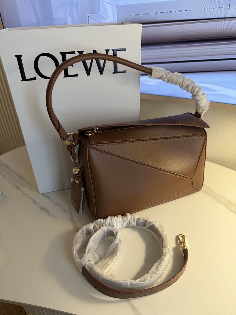 Loewe puzzle bag medium 29 cm (Category: Luxury Bags & Wallets) located in Manila. Submitted by beaumontandco (Listing ID 1463060018, Image 1). Description: Complete With box Dustbag Care cards.