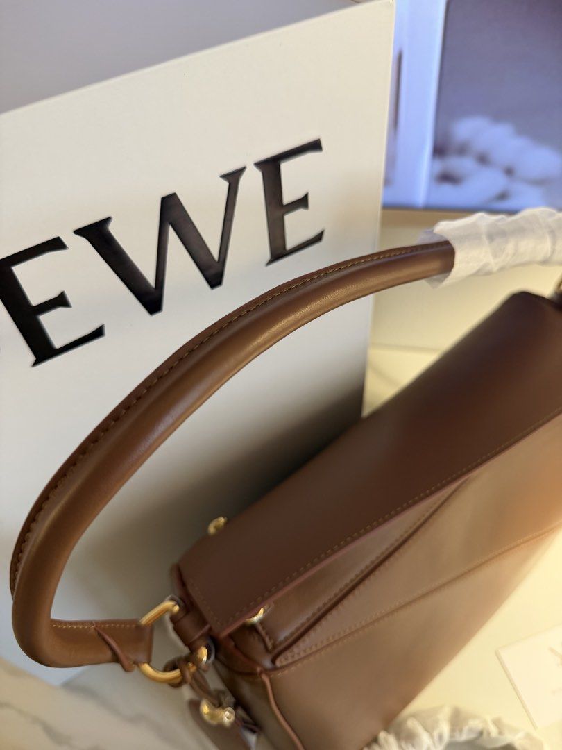 Loewe puzzle bag medium 29 cm (Category: Luxury Bags & Wallets) located in Manila. Submitted by beaumontandco (Listing ID 1463060018, Image 3). Description: Complete With box Dustbag Care cards.