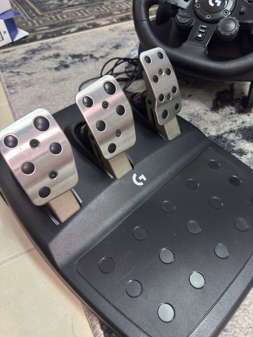 Logitech G923 Wheel and pedals + Shifter (PS/PC/Xbox) RUSH 10k (Category: Controllers) located in Pasig City. Submitted by robbiseraphin (Listing ID 1463065092, Image 3). Description: 🎮 Selling: Logitech G923 Wheel and pedals + Shifter (PS/PC/Xbox) - comes with wheel + pedals and shifter! - good condition! Pwede mag video call for assurance - no box na. Can provide ecobag 💰 For only 10,000 php! —————— 📱PM me if you have any questions .