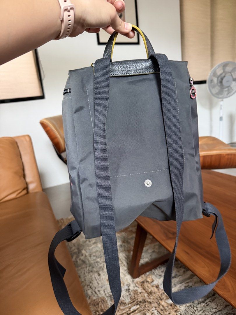 Longchamp Le Pliage Backpack Dark Grey (Category: Backpacks) located in Manila. Submitted by burgerking323 (Listing ID 1463005064, Image 2). Description: - Price is negotiable - Brand: Longchamp - Model: Le Pliage Backpack - Color: Dark Grey - Material: Nylon with Leather Trim - Features: Main zip compartment, front flap pocket with snap button closure, adjustable shoulder straps - Condition: Minor red marks on the side (visible in photos) - Idea