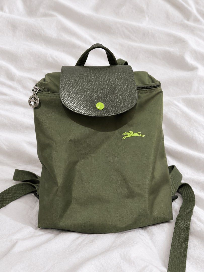 Longchamp Le Pliage Backpack Green (Category: Backpacks) located in Manila. Submitted by royalbear_87f903 (Listing ID 1462928591, Image 1). Description: Green Longchamp Le Pliage backpack. Nylon material with leather trim. Features the signature horse logo embroidery. Has a top handle and adjustable shoulder straps. Zipper closure with a snap button flap. Great for everyday use or travel..