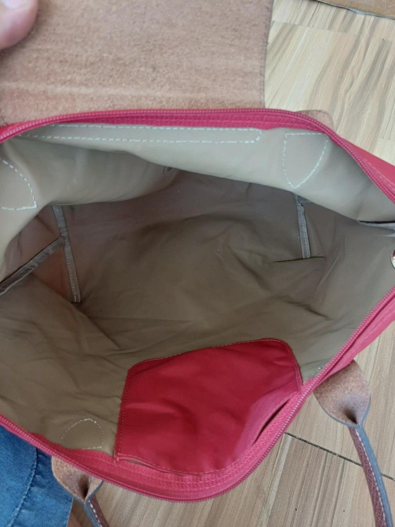 Longchamp Le Pliage Tote Bag Red (Category: Luxury Bags & Wallets) located in Bay. Submitted by silverhorse-59c851 (Listing ID 1463102924, Image 3). Description: - Classic Longchamp tote bag in a vibrant red. - Made with durable nylon and genuine leather handles. - Ample interior space for all your essentials. - Features a convenient small inner pocket. - Folds down easily for compact storage. - Ideal everyday bag for work, errands, or travel..