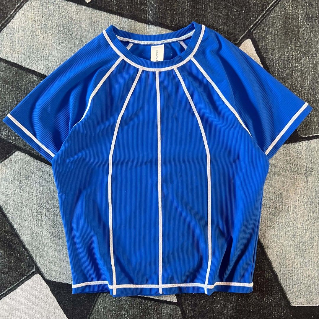 Lorna Jane Blue Ribbed Athletic top (Category: Activewear) located in Cebu City. Submitted by royalwolf-2a85 (Listing ID 1462969919, Image 1). Description: - Brand: Lorna Jane - Color: Blue - Size: XXL - width 18 - length 21 - like New - no issue - Features: Ribbed texture, white piping details, short sleeves, crew neck - Versatile: Great for workouts or casual wear - Origin: Made in China.