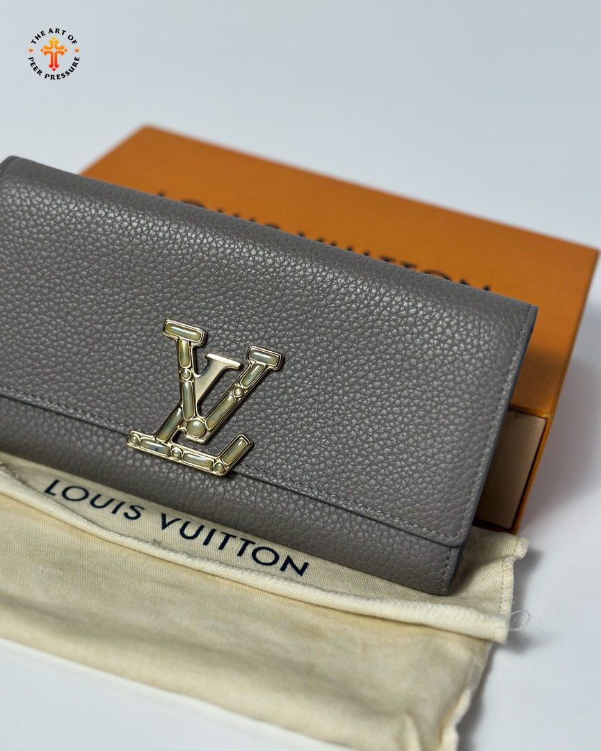 Louis Vuitton Capucines Wallet (Category: Luxury Bags & Wallets) located in Calamba. Submitted by theartofpeerpressurelgn (Listing ID 1463053200, Image 2). Description: LV Capucines Wallet Like new, complete with COA. Retails for ₱87,500 in stores. Selling for ₱34,900 only. 💳 Layaway available 💯 Guaranteed Authentic 📍 Calamba City, Laguna 🚚 Lalamove / LBC DM us to purchase. FB: The Art of Peer Pressure IG: @theartofpeerpressurelgn.