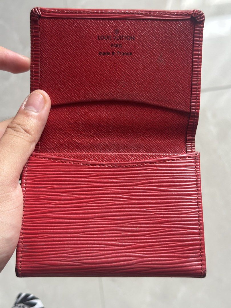 Louis Vuitton Epi Leather Red Card Holder (Category: Luxury Bags & Wallets) located in Manila. Submitted by luxe_aethel (Listing ID 1463019092, Image 3). Description: - Authentic Louis Vuitton Card Holder - Made in France - Material: Red Epi Leather with embossed LV logo - Features ample card space - Condition: Shows some signs of wear on edges and interior, consistent with use - A classic and stylish accessory for everyday essentials.