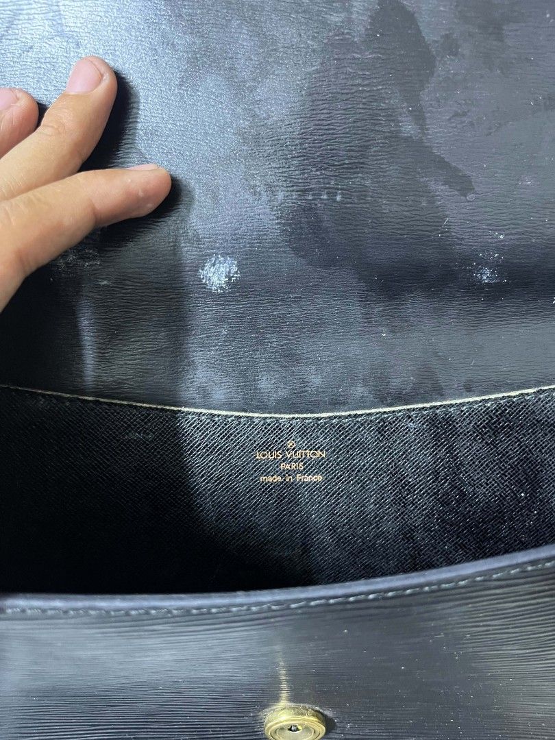 Louis Vuitton Epi Leather Shoulder Bag (Category: Luxury Bags & Wallets) located in Lapu Lapu. Submitted by margaux099 (Listing ID 1463052085, Image 3). Description: - Authentic Louis Vuitton shoulder bag - Color: Black - Material: Epi leather - Hardware: Gold-tone - Interior: A few minor marks - Serial Number: MI0935 - Approximate Dimensions: 9.5" (W) x 7" (H) - Strap: Adjustable.