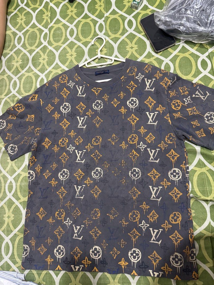 Louis Vuitton Monogram All Over Print T-Shirt (Category: Tshirts & Polo Shirts ) located in Guagua. Submitted by eloisa.dpthrifts11 (Listing ID 1462907991, Image 2). Description: - Authenticity not guaranteed Louis Vuitton t-shirt - All-over iconic LV monogram print - Dark grey base with orange and white accents - Short sleeves - Crew neck - Perfect statement piece Dimes L-27.5 W- 22.5.