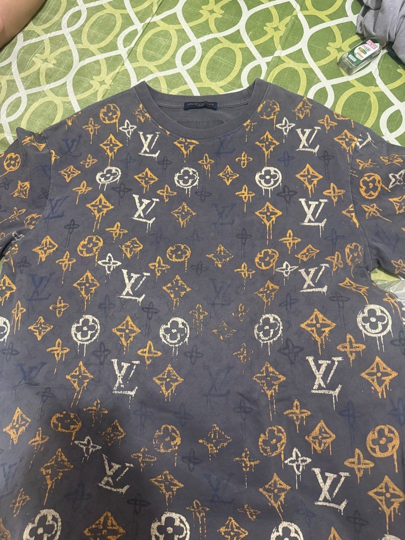 Louis Vuitton Monogram All Over Print T-Shirt (Category: Tshirts & Polo Shirts ) located in Guagua. Submitted by eloisa.dpthrifts11 (Listing ID 1462907991, Image 3). Description: - Authenticity not guaranteed Louis Vuitton t-shirt - All-over iconic LV monogram print - Dark grey base with orange and white accents - Short sleeves - Crew neck - Perfect statement piece Dimes L-27.5 W- 22.5.
