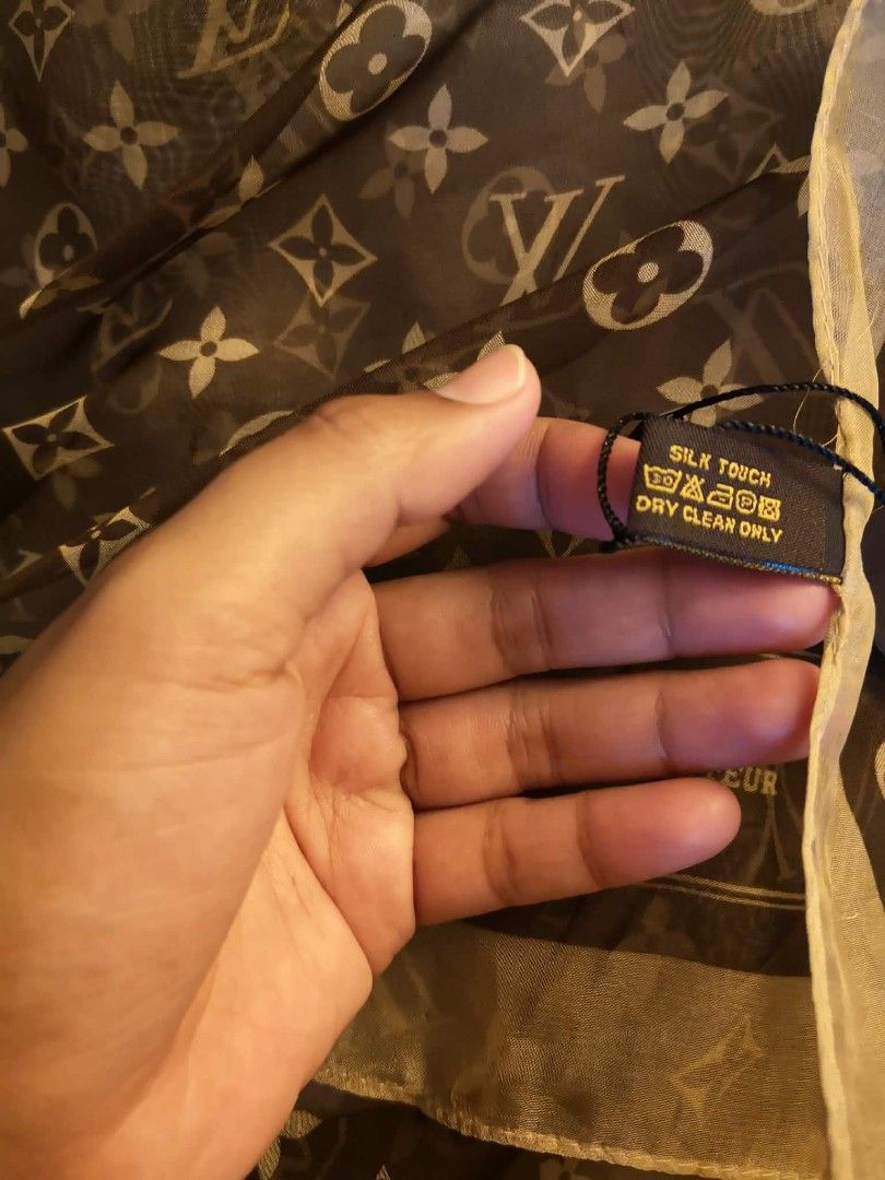 Louis Vuitton Monogram Silk Touch Scarf (Category: Scarves) located in Manila. Submitted by anez06 (Listing ID 1463039299, Image 3). Description: -Louis Vuitton scarf - Classic brown and beige monogram pattern - Soft silk touch material - Size: Approx. 140cm x 140cm - Care: Dry clean only - Includes original tag - Perfect accessory to elevate any look.