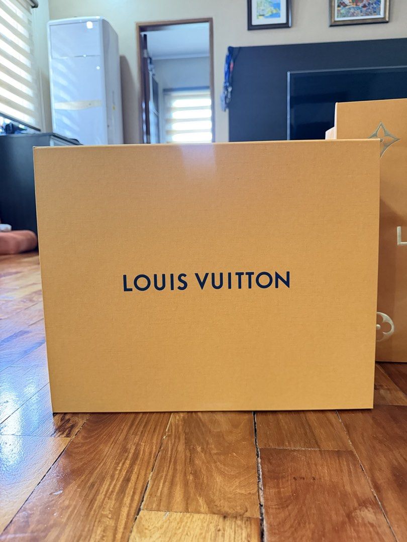 Louis Vuitton Shopping Bag and Box (Category: Storage Boxes & Baskets) located in Manila. Submitted by jmdc30 (Listing ID 1462925439, Image 2). Description: - Authentic Louis Vuitton orange shopping bag - Authentic Louis Vuitton orange box (empty) - Classic LV logo design - Ideal for gifting or storing small luxury items - Box model for LV Neonoe BB Bucket Bag.