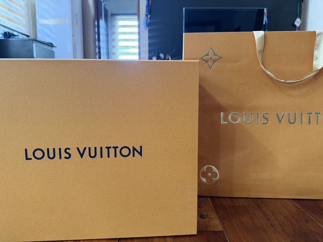 Louis Vuitton Shopping Bag and Box (Category: Storage Boxes & Baskets) located in Manila. Submitted by jmdc30 (Listing ID 1462925439, Image 1). Description: - Authentic Louis Vuitton orange shopping bag - Authentic Louis Vuitton orange box (empty) - Classic LV logo design - Ideal for gifting or storing small luxury items - Box model for LV Neonoe BB Bucket Bag.