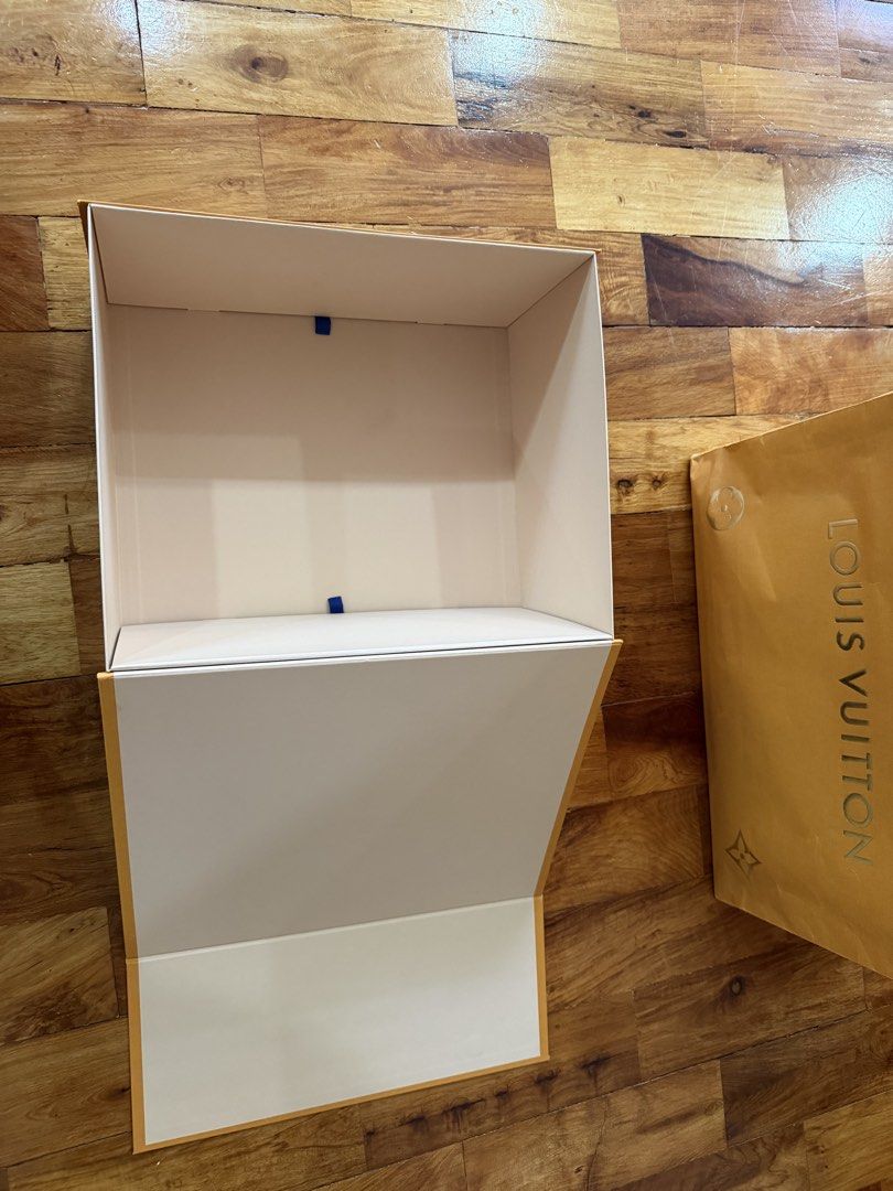 Louis Vuitton Shopping Bag and Box (Category: Storage Boxes & Baskets) located in Manila. Submitted by jmdc30 (Listing ID 1462925439, Image 3). Description: - Authentic Louis Vuitton orange shopping bag - Authentic Louis Vuitton orange box (empty) - Classic LV logo design - Ideal for gifting or storing small luxury items - Box model for LV Neonoe BB Bucket Bag.