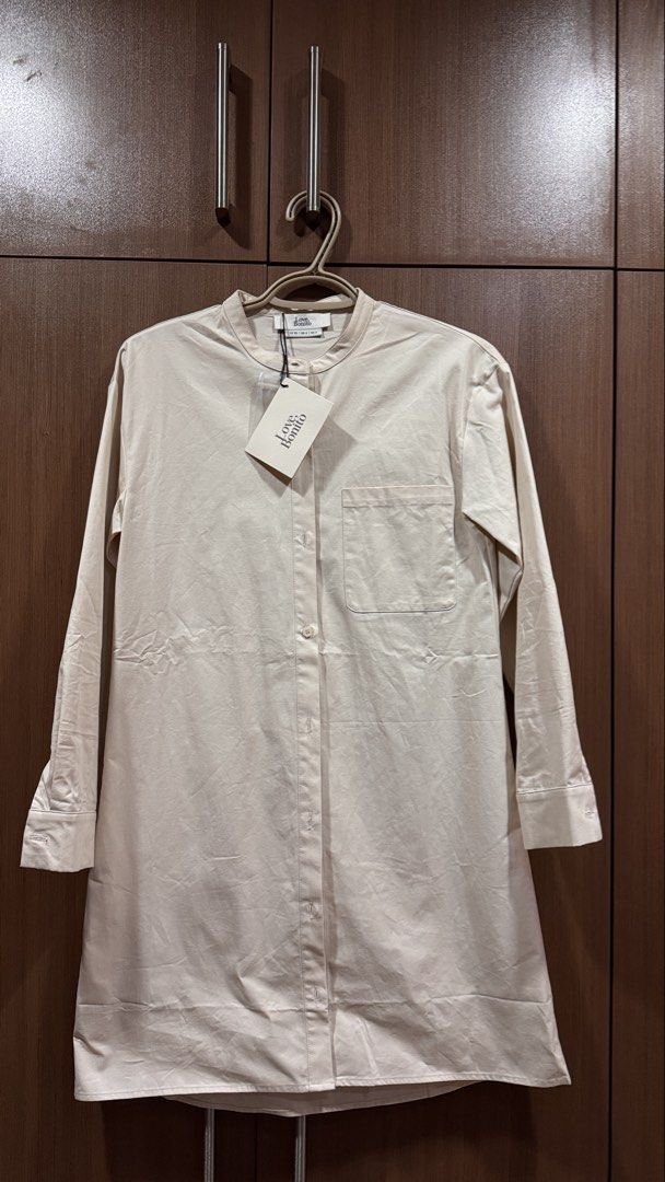Love Bonito Cream Button Down Dress (Category: Dresses) located in Caloocan City. Submitted by zmn888 (Listing ID 1463010648, Image 1). Description: - Brand new Love Bonito button down dress - Color: Cream - Size: XS - Features: Button-up front, Mandarin collar - Material: Light cotton blend - Style: Versatile for casual or smart casual wear - Condition: Brand new with tags.