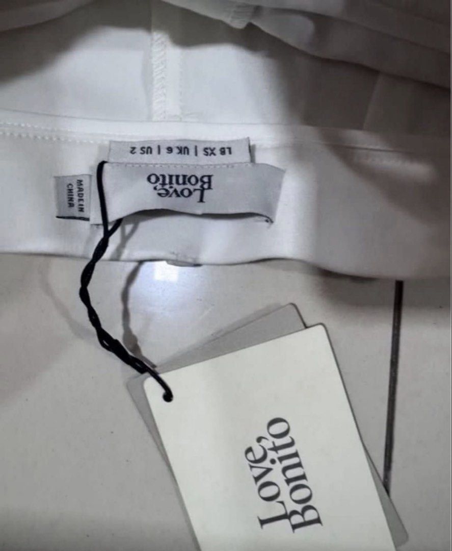 Love, Bonito White Tailored Pants (Category: Other Bottoms) located in Manila. Submitted by decluterthings888 (Listing ID 1462914868, Image 3). Description: - Brand: Love, Bonito - Color: White - Style: Tailored Pants - Condition: Brand new with tag attached - Size: XS - Measurements: Waist 23.5-24.5 inches, Hip 33.5-34.5 inches - Origin: Made in China - Features: Classic cut, versatile for work or smart casual outfits.