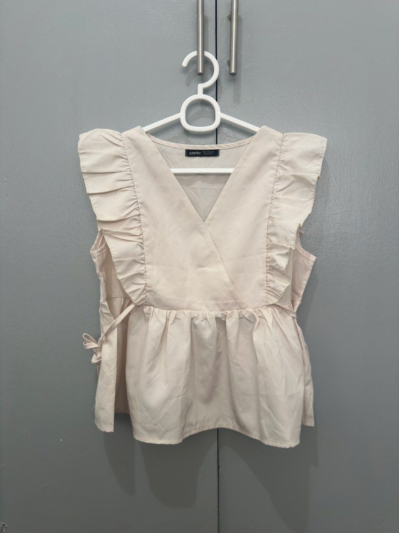 LOVITO cream v neck ruffles top (Category: Blouses) located in Quezon City. Submitted by seungshop (Listing ID 1463114584, Image 1). Description: negotiable, send offers - used twice only - mop: gcash / bpi - mod: lalamove / grab / ggx.