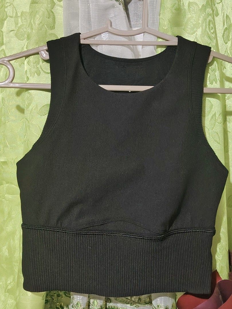Lululemon Ribbed Tank Tops (Black & Beige) (Category: Sleeveless) located in Santa Rosa. Submitted by RRRR0520 (Listing ID 1462934506, Image 3). Description: - Set of 2 Lululemon tank tops - Black: Ribbed, cropped style with a wide band - Beige: with a stylish side tie detail - Both feature the iconic Lululemon logo - Versatile: Ideal for workouts or everyday casual wear - Comfortable and fashionable design.