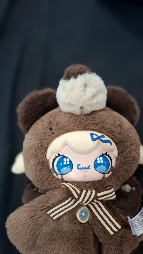 Lulumi Plush Tou (Category: Plushies & Soft Toys) located in Manila. Submitted by jonelllliiii (Listing ID 1462982446, Image 1). Description: - Adorable brown bear plush toy - Features big, bright blue anime-style eyes - Comes with a cute striped bow tie - Super soft and cuddly texture - Ideal for plush toy collectors - Makes a wonderful gift for any occasion.