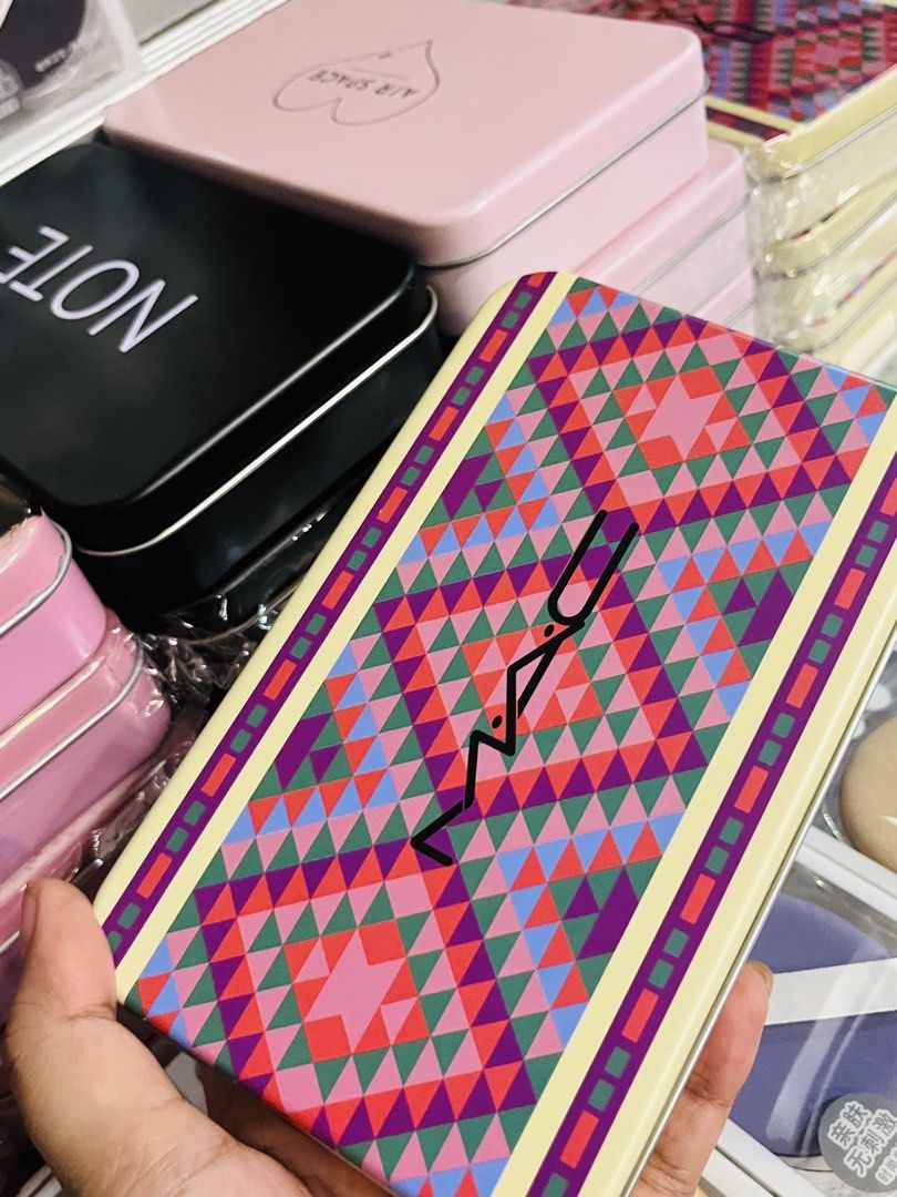 MAC Makeup Brush Set with Decorative Tin Case (Category: Makeup) located in Santa Cruz. Submitted by prelovedbysky803 (Listing ID 1463060578, Image 1). Description: - Cute MAC makeup brush set - Comes in a colorful, patterned tin case with a vibrant geometric design - Includes several brushes with elegant gold handles - Ideal for travel or everyday makeup application - Brushes are clean and well-maintained.