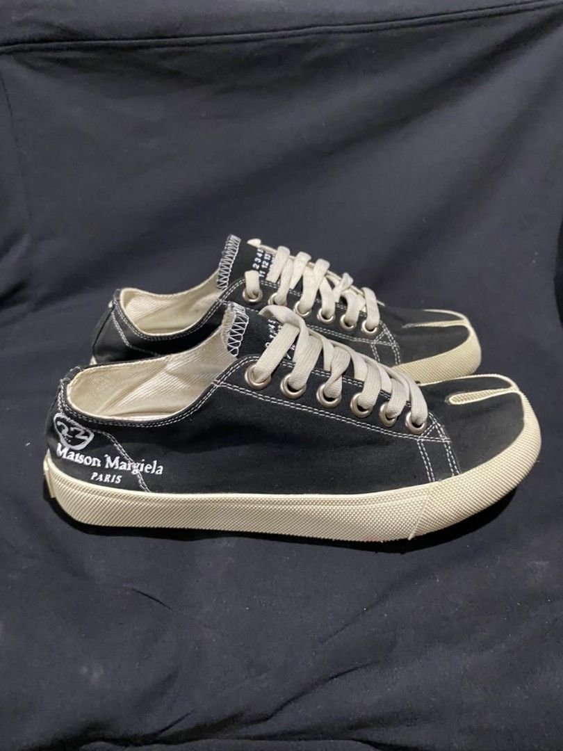 Maison Margiela Tabi Low Top Sneakers (Category: Sneakers & Footwear) located in Zamboanga. Submitted by rkrey (Listing ID 1463116829, Image 2). Description: Maison Margiela Tabi Low Top Sneakers in black canvas, featuring the brand's iconic split-toe design and contrast white logo lettering Size 38 Made In Vietnam Slightly Negotiable Price.