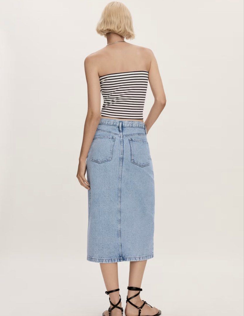 MANGO Light blue Denim Midi Skirt with Front Slit medium (Category: Skirts) located in Cagayan de Oro. Submitted by jeirn (Listing ID 1463114443, Image 3). Description: - Classic light wash denim midi skirt - Features a front slit for easy movement - Two back pockets - Belt loops for styling options - Versatile for casual outings and everyday wear.