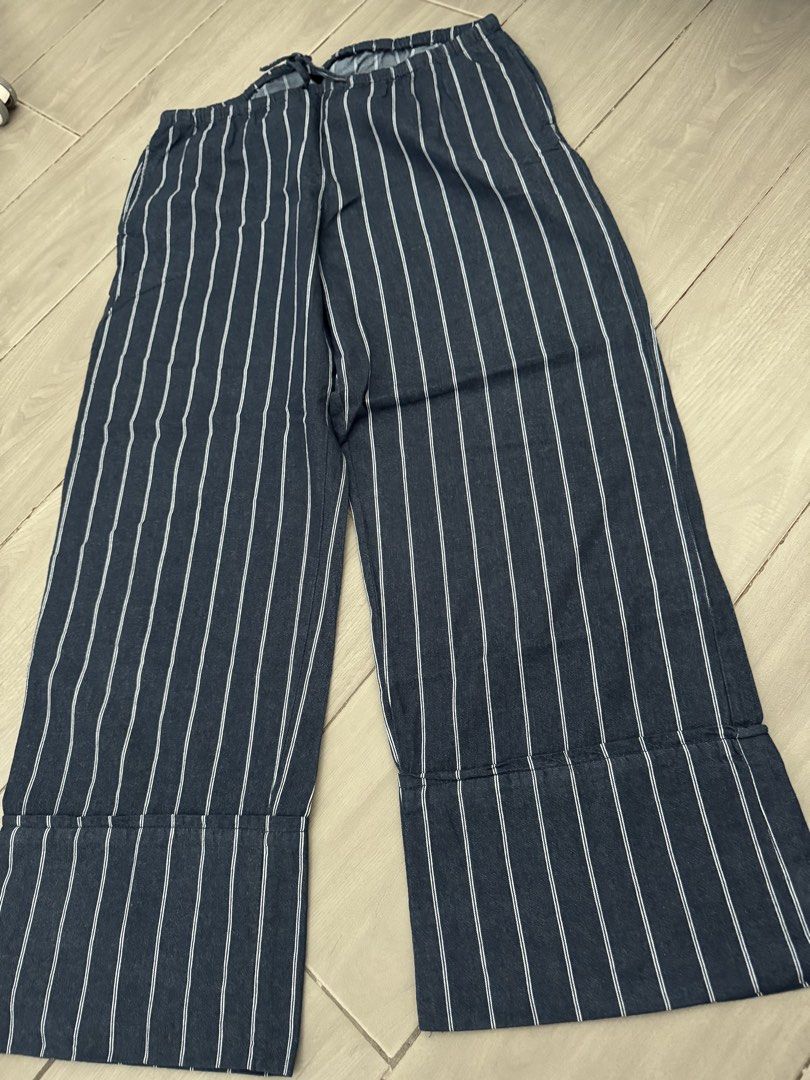 Mango Navy Striped Wide Leg Pants with Drawstring Waist (Category: Other Bottoms) located in Taguig. Submitted by sqaumejada (Listing ID 1462894404, Image 1). Description: - Navy blue pants with white vertical stripes - Wide leg cut for a relaxed fit - Comfortable elastic waistband with adjustable drawstring tie - Cuffed hem detail - Ideal for casual, everyday styling fits l-xxl.