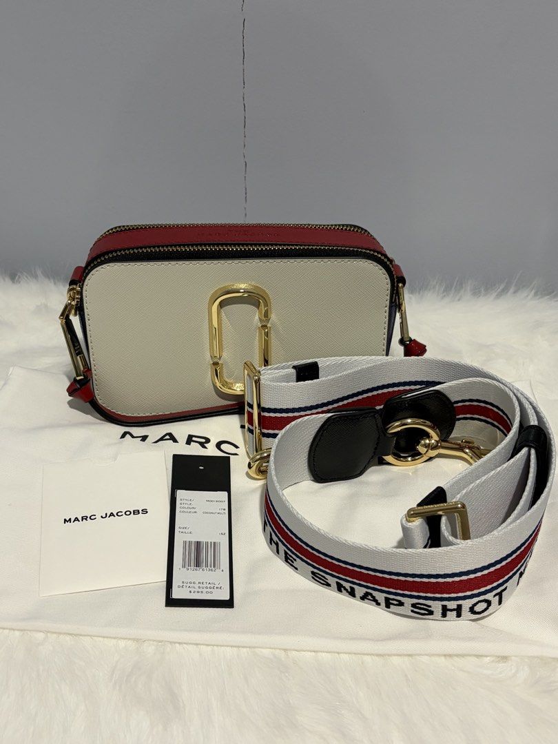 Marc Jacobs The Snapshot Crossbody Bag (Category: Luxury Bags & Wallets) located in Davao. Submitted by mgnmm (Listing ID 1463041500, Image 1). Description: - Authentic Marc Jacobs Snapshot Camera Bag - Color: 143 - Coconut Multi - Signature Gold Double J hardware - Dual zip compartments for organized storage - Includes original adjustable strap - Comes with original dust bag - Never used. Brand new. - Ideal for everyday wear and versatile stylin