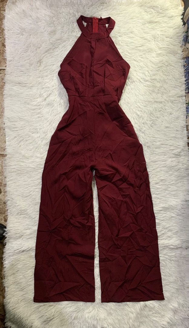 Maroon Halter Neck Wide Leg Jumpsuit (Category: Jumpsuits) located in Caloocan City. Submitted by emmalizz (Listing ID 1463068834, Image 1). Description: - Maroon halter neck jumpsuit - Wide leg pants - Back zipper closure - Fabric with a slight sheen - Ideal for night outs or special occasions - Comfortable and stylish.