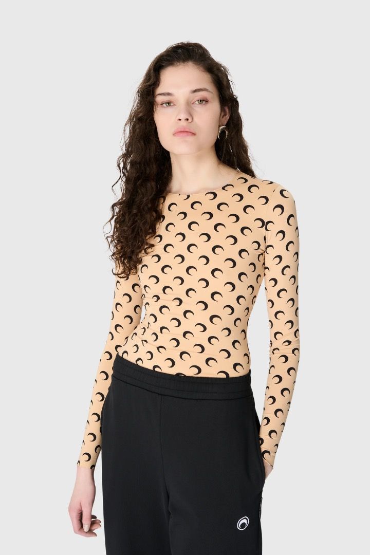 Marine Serre Moon Second Skin Top S/M (Category: Blouses) located in Antipolo. Submitted by bentakahitanoano (Listing ID 1463029676, Image 1). Description: The Marine Serre All Over Moon Second Skin Crewneck Top is a signature piece from the French designer Marine Serre, easily recognized by its iconic crescent moon monogram pattern. Designed to fit closely like a "second skin," this long-sleeved, crewneck jersey shirt features raw-edge cuffs and