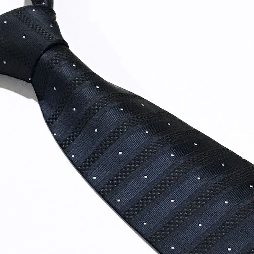 Mi Jun Jacquard Micro Dot Deep Navy Neck Tie (Category: Ties) located in Taguig. Submitted by retrogaze (Listing ID 1462959580, Image 1). Description: This 100% silk necktie by Mi Jun features a deep navy blue base with a rich, multi-textured weave. The body displays alternating horizontal bands of smooth satin and subtle basketweave textures, creating a muted shadow stripe effect. The design is detailed with an evenly spaced grid of tiny white j