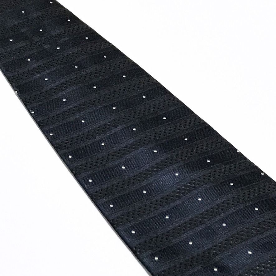Mi Jun Jacquard Micro Dot Deep Navy Neck Tie (Category: Ties) located in Taguig. Submitted by retrogaze (Listing ID 1462959580, Image 3). Description: This 100% silk necktie by Mi Jun features a deep navy blue base with a rich, multi-textured weave. The body displays alternating horizontal bands of smooth satin and subtle basketweave textures, creating a muted shadow stripe effect. The design is detailed with an evenly spaced grid of tiny white j