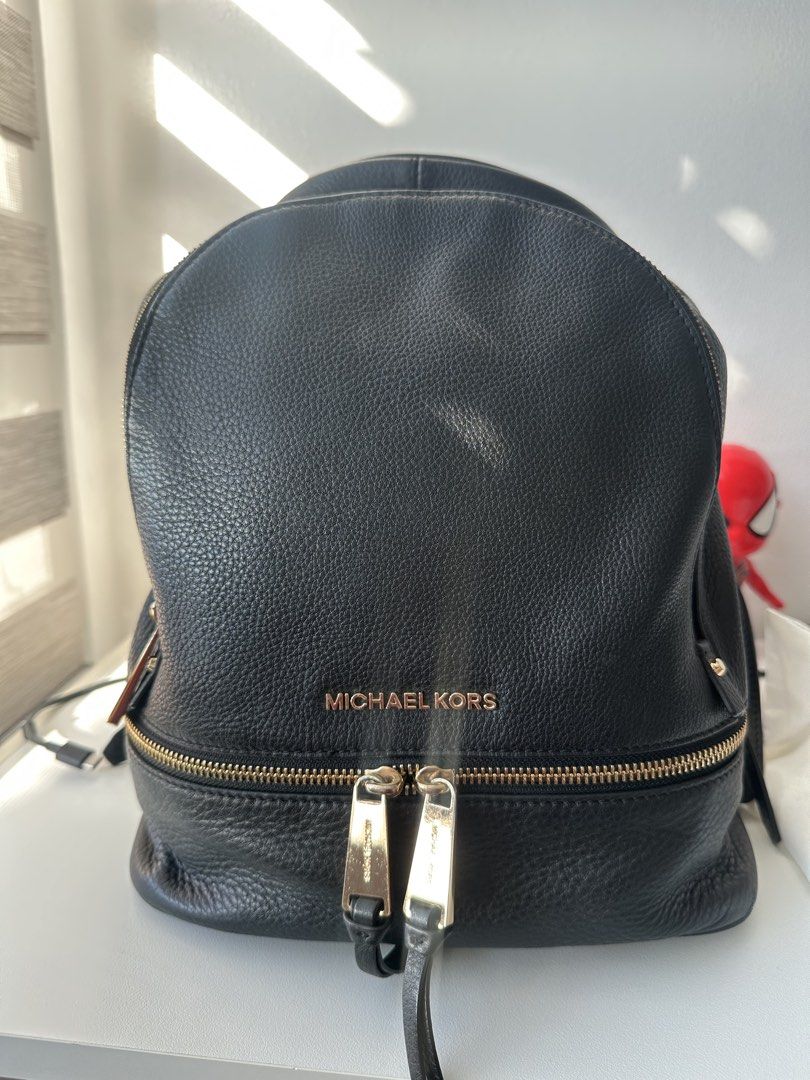 Michael Kors Black Leather Backpack Gold Hardware (Category: Backpacks) located in Pasig City. Submitted by staceylouieyu (Listing ID 1462908001, Image 1). Description: - Authentic Michael Kors black leather backpack - Elegant gold hardware on zippers and buckles - Ample interior space for essentials - Perfect for everyday use or travel - Inclusion: dustbag.