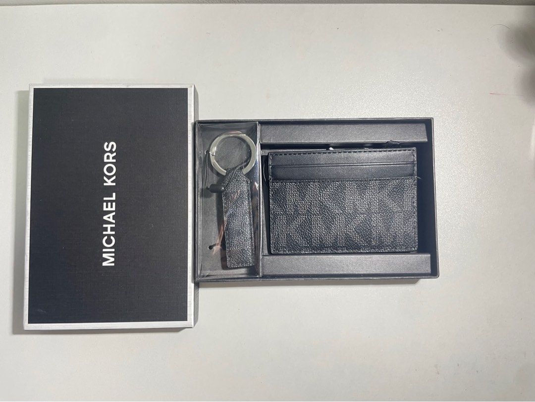 Michael Kors Cardholder wallet and Keychain Set Black Monogram (Category: Luxury Bags & Wallets) located in Quezon City. Submitted by kkuily (Listing ID 1462925015, Image 2). Description: - Authentic Michael Kors cardholder and keychain set - Classic black monogram pattern - Comes with original box - Keychain features a matching strap .