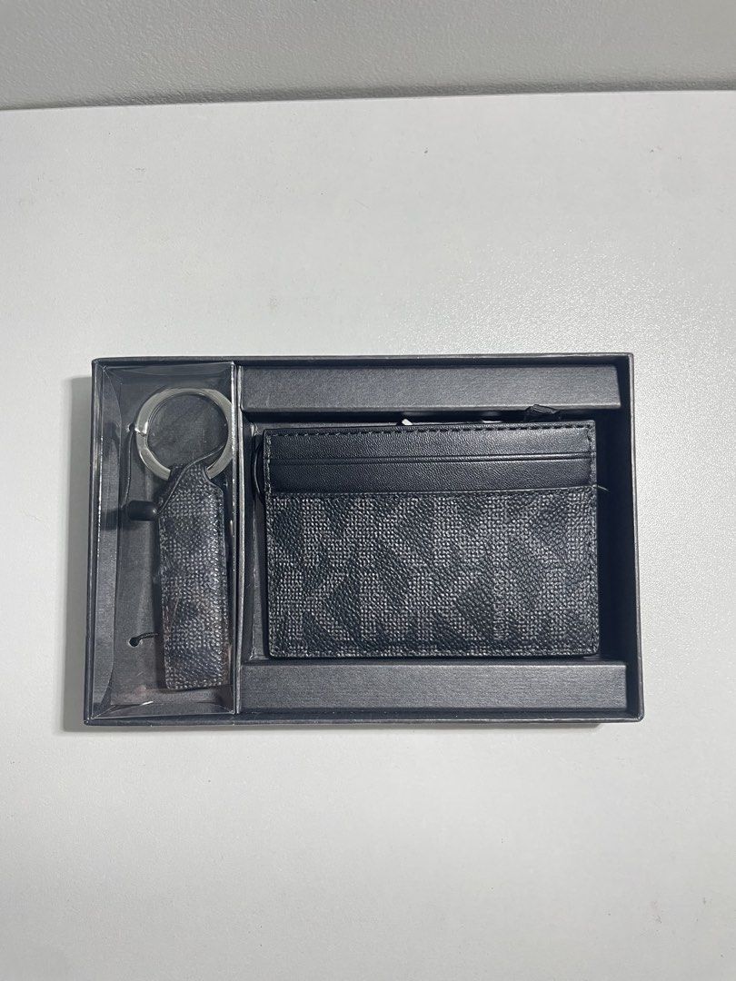 Michael Kors Cardholder wallet and Keychain Set Black Monogram (Category: Luxury Bags & Wallets) located in Quezon City. Submitted by kkuily (Listing ID 1462925015, Image 1). Description: - Authentic Michael Kors cardholder and keychain set - Classic black monogram pattern - Comes with original box - Keychain features a matching strap .