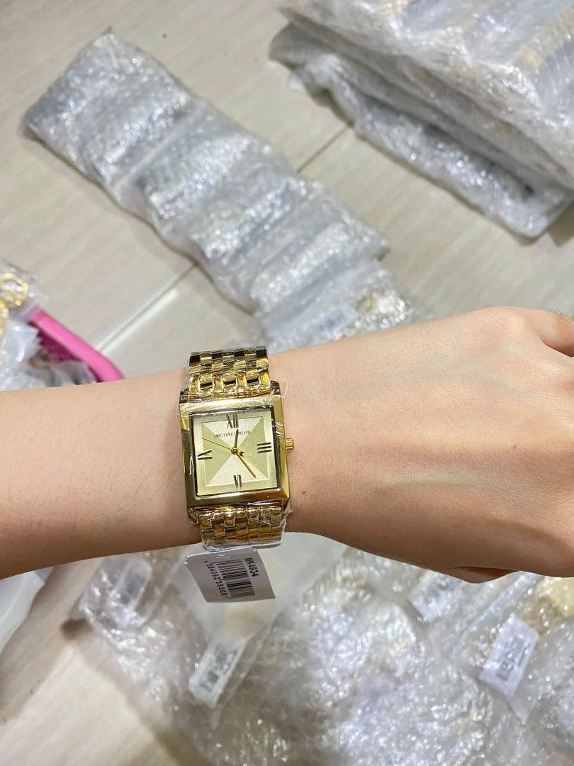 Michael Kors Square Watch - Two Tone & Gold (Category: Women's Watches) located in Manila. Submitted by chaionlineshop (Listing ID 1462998532, Image 2). Description: - Authentic Michael Kors watch - Available in two-tone (silver and gold) - Available in all gold (big and small sizes) - Brand new with tags attached - Perfect gift for yourself or a loved one - Message for more details.