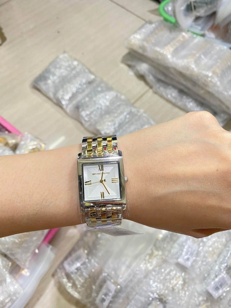 Michael Kors Square Watch - Two Tone & Gold (Category: Women's Watches) located in Manila. Submitted by chaionlineshop (Listing ID 1462998532, Image 1). Description: - Authentic Michael Kors watch - Available in two-tone (silver and gold) - Available in all gold (big and small sizes) - Brand new with tags attached - Perfect gift for yourself or a loved one - Message for more details.