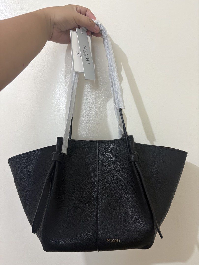 MICHI Black Pebbled Leather Tote Bag with Pouch (Category: Tote Bags) located in Quezon City. Submitted by karinadv (Listing ID 1462952375, Image 1). Description: - MICHI tote bag in black pebbled leather - Includes matching pouch and dust bag - Structured shape with unique knotted strap details.