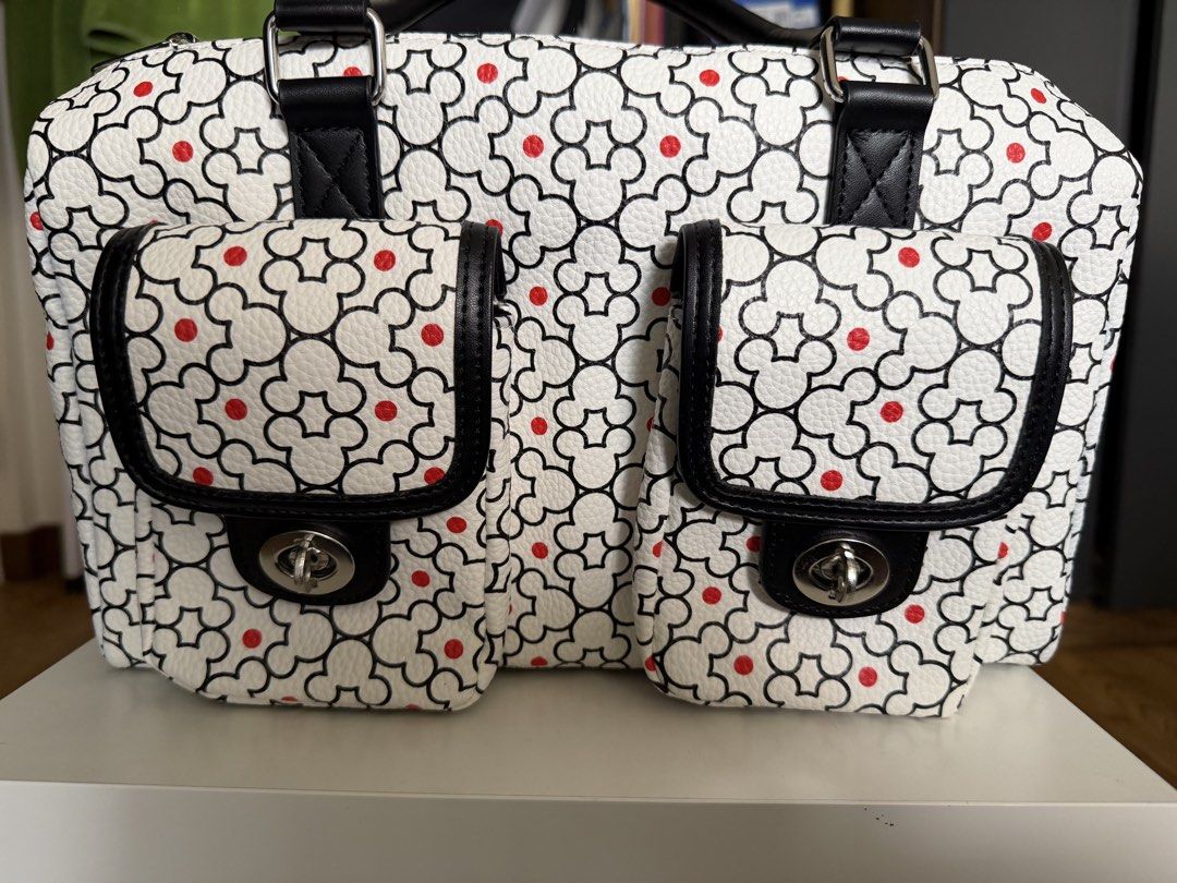 Mickey Bag from Disney Store (Category: Purses & Pouches) located in Quezon City. Submitted by angge2330 (Listing ID 1462896322, Image 1). Description: USED ONCE ONLY - for Disney cruise - Adorable handbag with a unique white, black, and red dot pattern. - Two convenient front pockets with secure clasp closures. - Stylish black handles and trim. - Reliable top zipper closure for security. - Ideal for everyday use and carrying your essentials..
