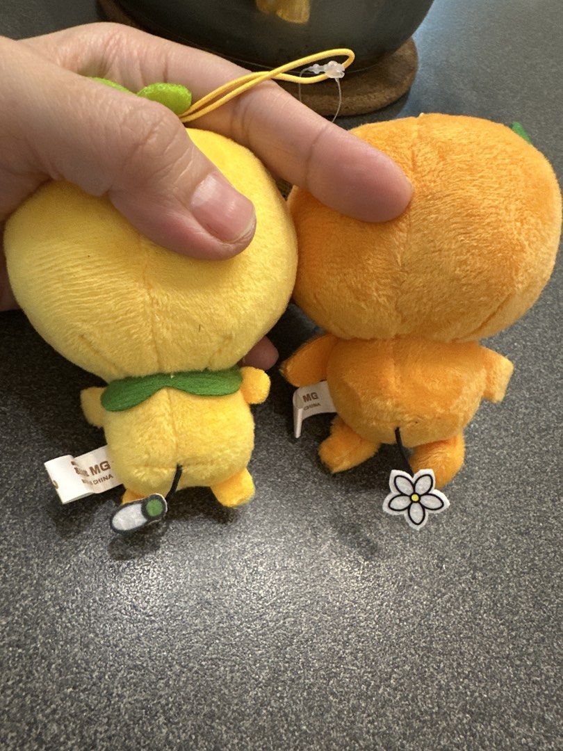 Mikyan and Komikyan plush set (Category: Plushies & Soft Toys) located in Cainta. Submitted by shopbyyna (Listing ID 1463008943, Image 2). Description: - Adorable fruit plushies set! - One yellow plush with green leaf sprout. - One orange plush with green leaves. - Both feature cute embroidered faces. - Comes with original tags attached. - Super soft and cuddly material. - Ideal for collecting or as a delightful gift. - Perfect for kids and fruit