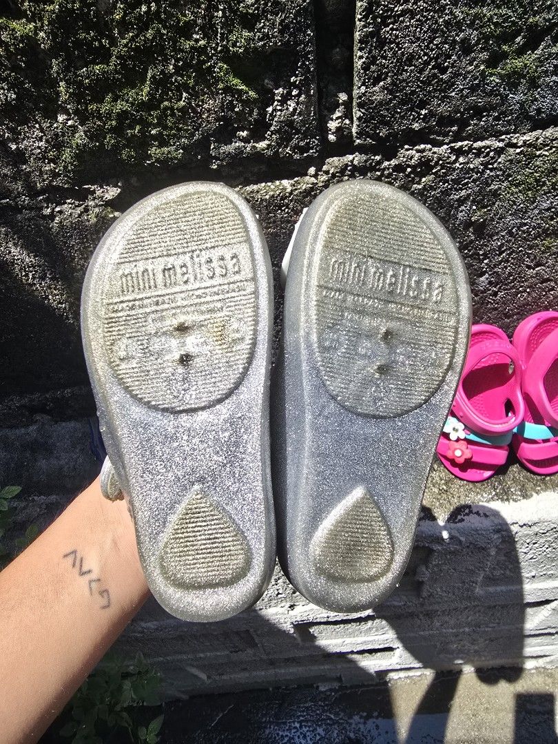 Mini Melissa Glitter Cat Sandals (Category: Babies & Kids Fashion) located in Quezon City. Submitted by jeri21 (Listing ID 1463060489, Image 3). Description: - Size 15cm - Adorable Mini Melissa sandals for kids - Sparkly silver glitter finish - Fun cat face design on the front - Easy strap closure for a secure fit - Comfortable for playtime and casual outings - Features Mini Melissa branding on the sole.