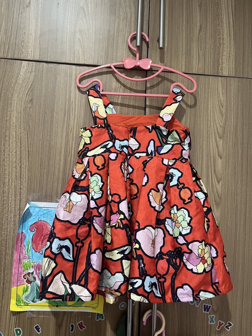 Mini Peace Floral Dress Size 110 (Category: Babies & Kids Fashion) located in Pasig City. Submitted by stormyera19 (Listing ID 1463020908, Image 3). Description: - Adorable red dress with a vibrant floral print. - Features a flattering flared skirt. - Comfortable shoulder straps. - Fabric has a lovely sheen. - Ideal for parties, casual outings, or everyday wear. - Nice and vibrant print perfect for Christmas! - Size 110 / fits 2-3 years old - Hon