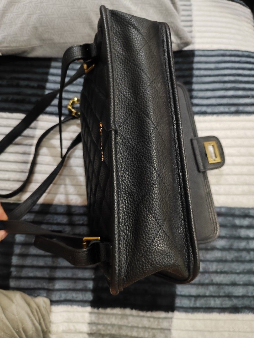 Black Quilted Backpack with Gold Hardware (Category: Backpacks) located in Manila. Submitted by journeypreloved (Listing ID 1463039361, Image 3). Description: NEGOTIABLE!!! - Stylish black quilted backpack - Features a secure gold turn-lock closure on the front flap - Includes a top handle and adjustable straps for comfortable carrying -May cabinet/storage smell.