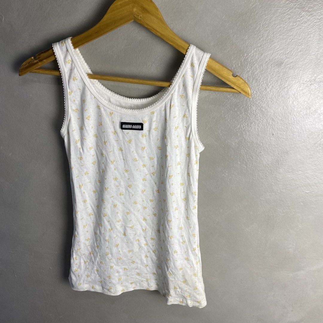Miu Miu Top (Category: Luxury Apparel) located in Quezon City. Submitted by rebirthalley (Listing ID 1463066654, Image 3). Description: Width-13 Length-22 Shoulder-10 Excellent Condition No flaws.