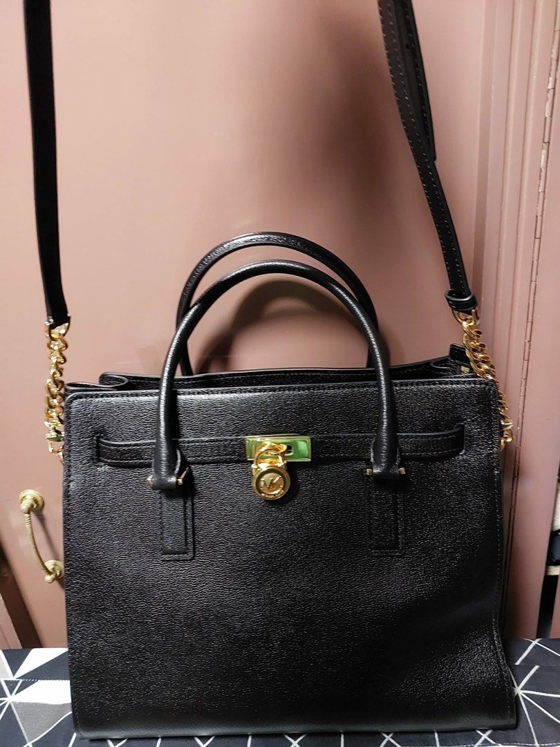 Mk hamilton (Category: Luxury Bags & Wallets) located in Mandaluyong City. Submitted by metrosaka17_ph (Listing ID 1462890761, Image 2). Description: black pebbled leather Michael Kors Hamilton satchel featuring a signature gold-tone MK padlock on the front..