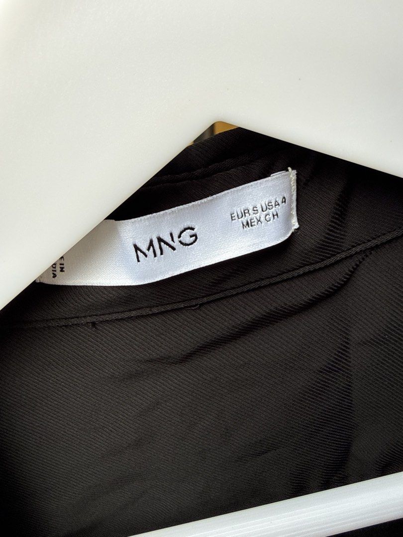 MNG Black Button-Up Shirt (Category: Shirts) located in Manila. Submitted by mcpascua (Listing ID 1462958747, Image 2). Description: - Black MNG shirt - Button-up style with collar - Long sleeves - Relaxed fit - Versatile for casual or smart-casual wear.