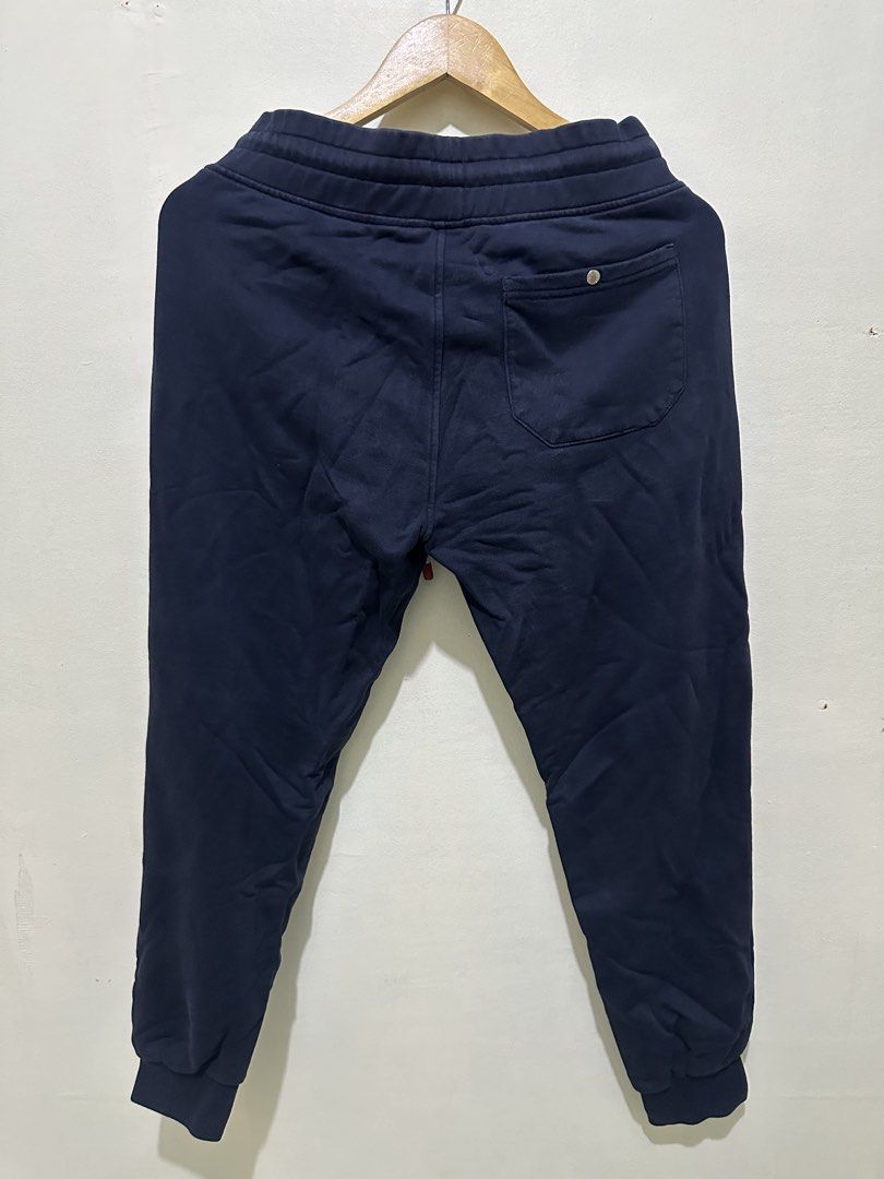 Moncler Navy Blue Sweatpants Size 2 (Category: Joggers) located in Tagum. Submitted by ritarits572 (Listing ID 1463057684, Image 2). Description: - Navy blue Moncler sweatpants - Iconic Moncler logo patch on left leg - Adjustable drawstring waist - Two side pockets and one back pocket - Ribbed cuffs - Made in Italy - Size: 2.